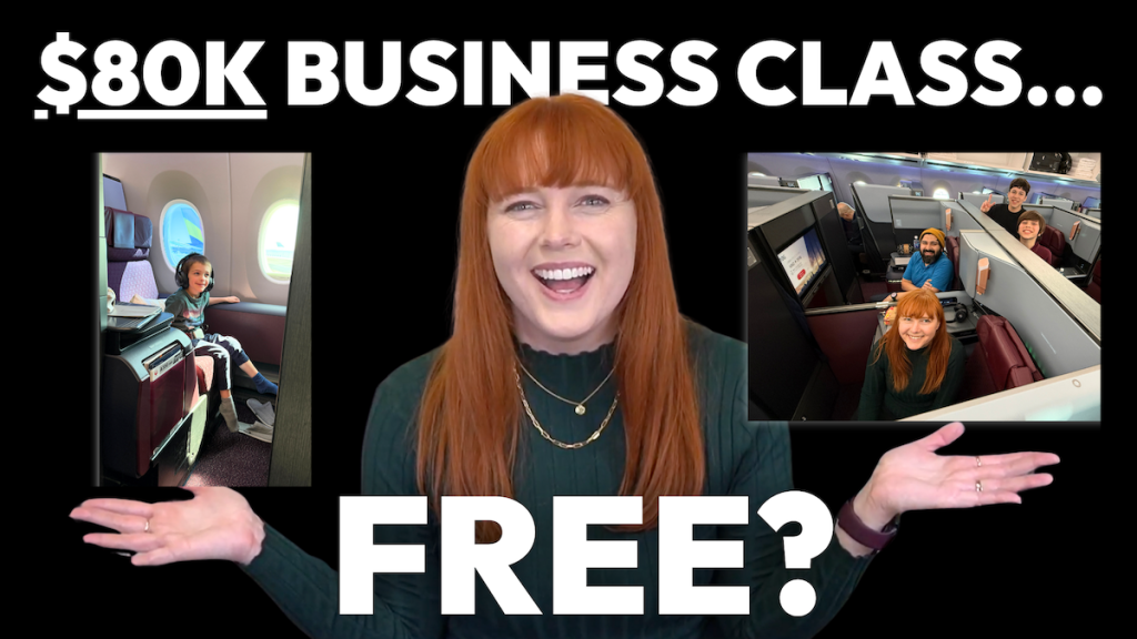 Adelaide smiling and showing her business class seats during her family travel