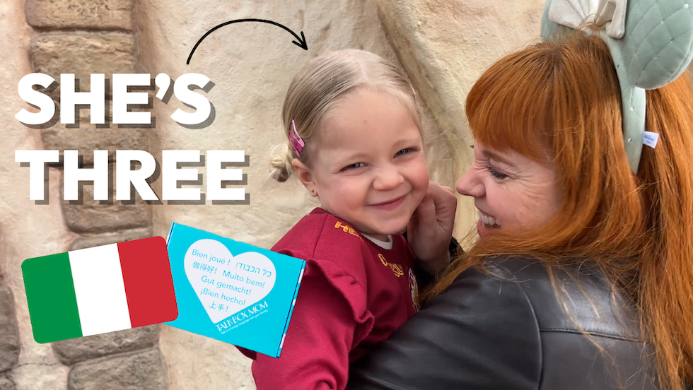 Adelaide smiling with her niece and they use Italian together at Disneyland with TalkBox.Mom