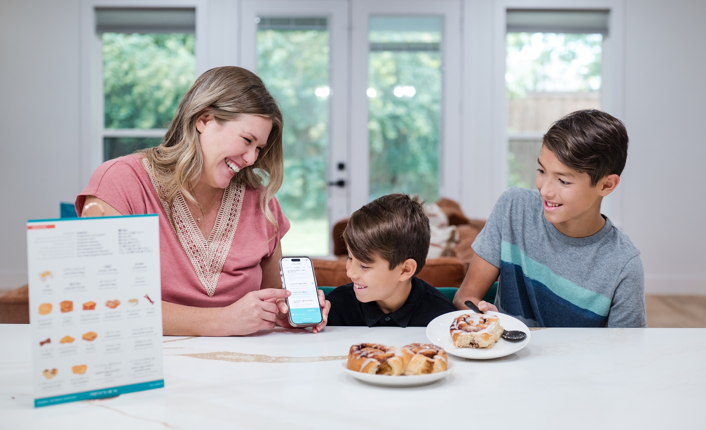 Fluency Family practicing their phrase from the Drinks and Dining Box