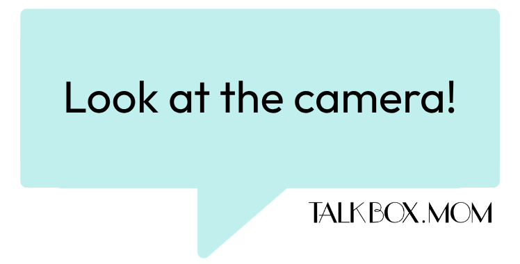A speech bubble that says Look at the camera TalkBoxMom